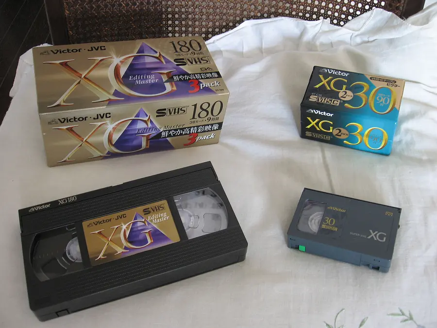 Full-size VHS tape beside a smaller VHS-C tape